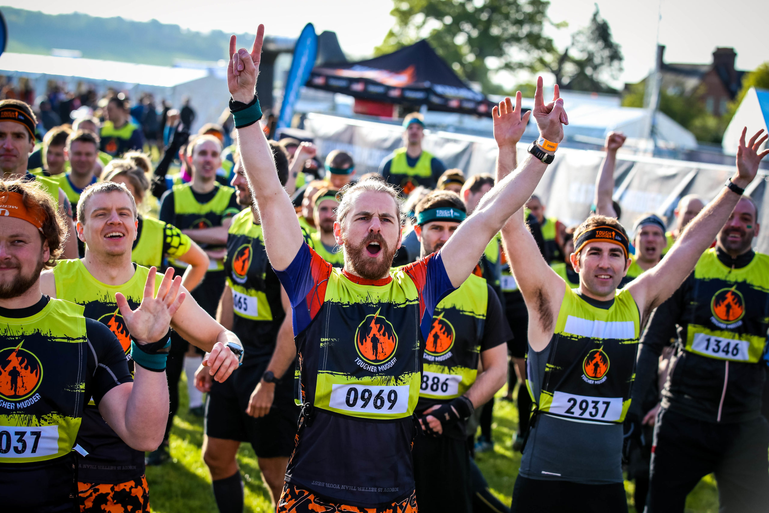 Men standing with their arms up