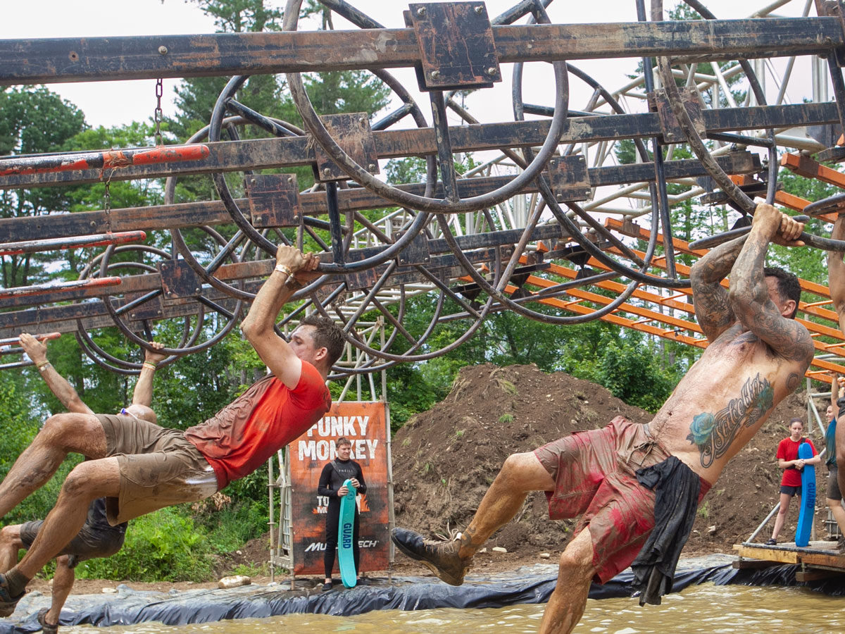 two men on monkey bars