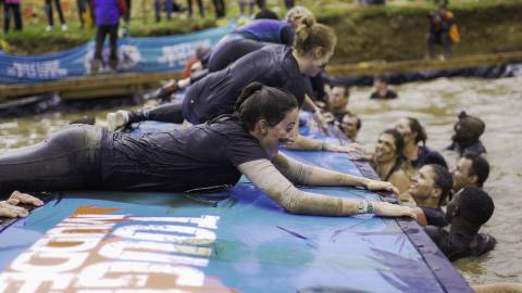 Team going over obstacle