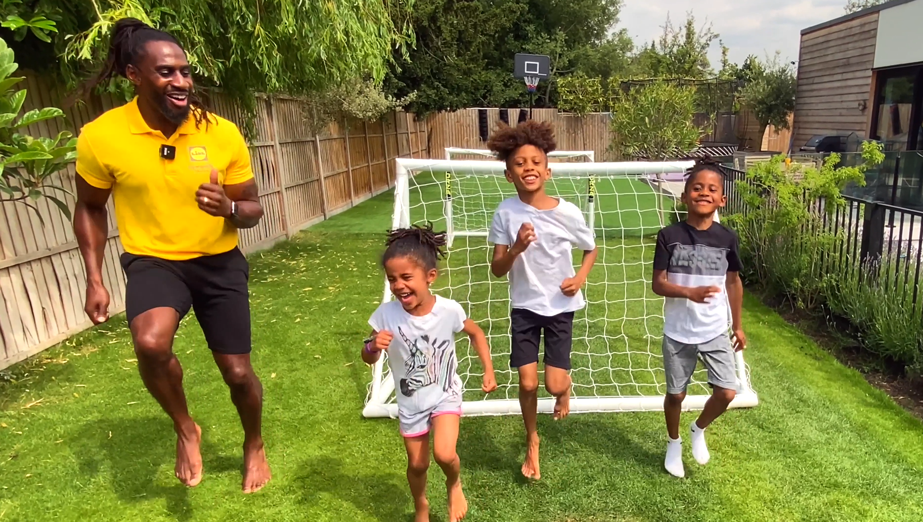 Kids and dad playing in garden