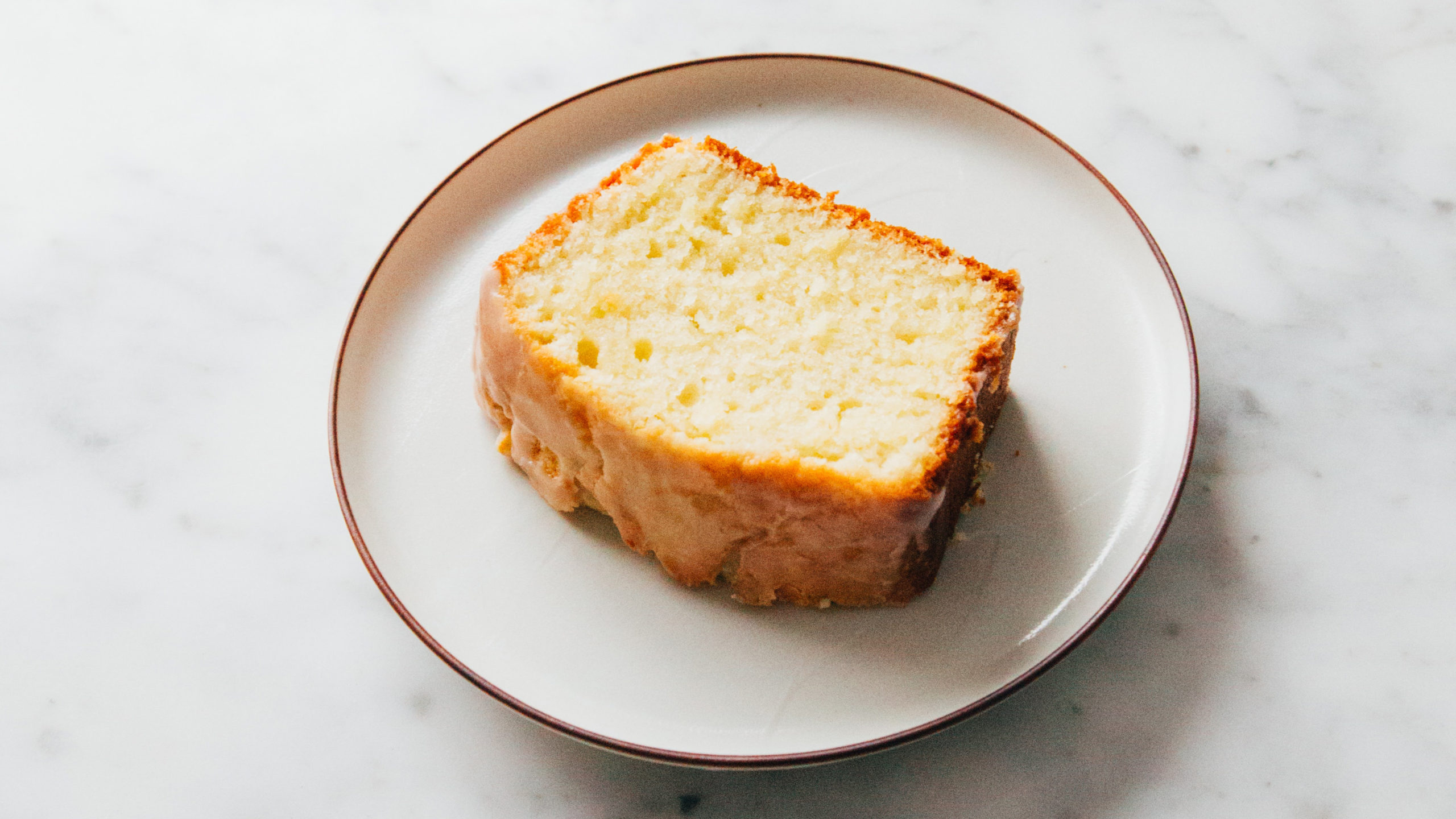 A slice of lemon cake on a plate