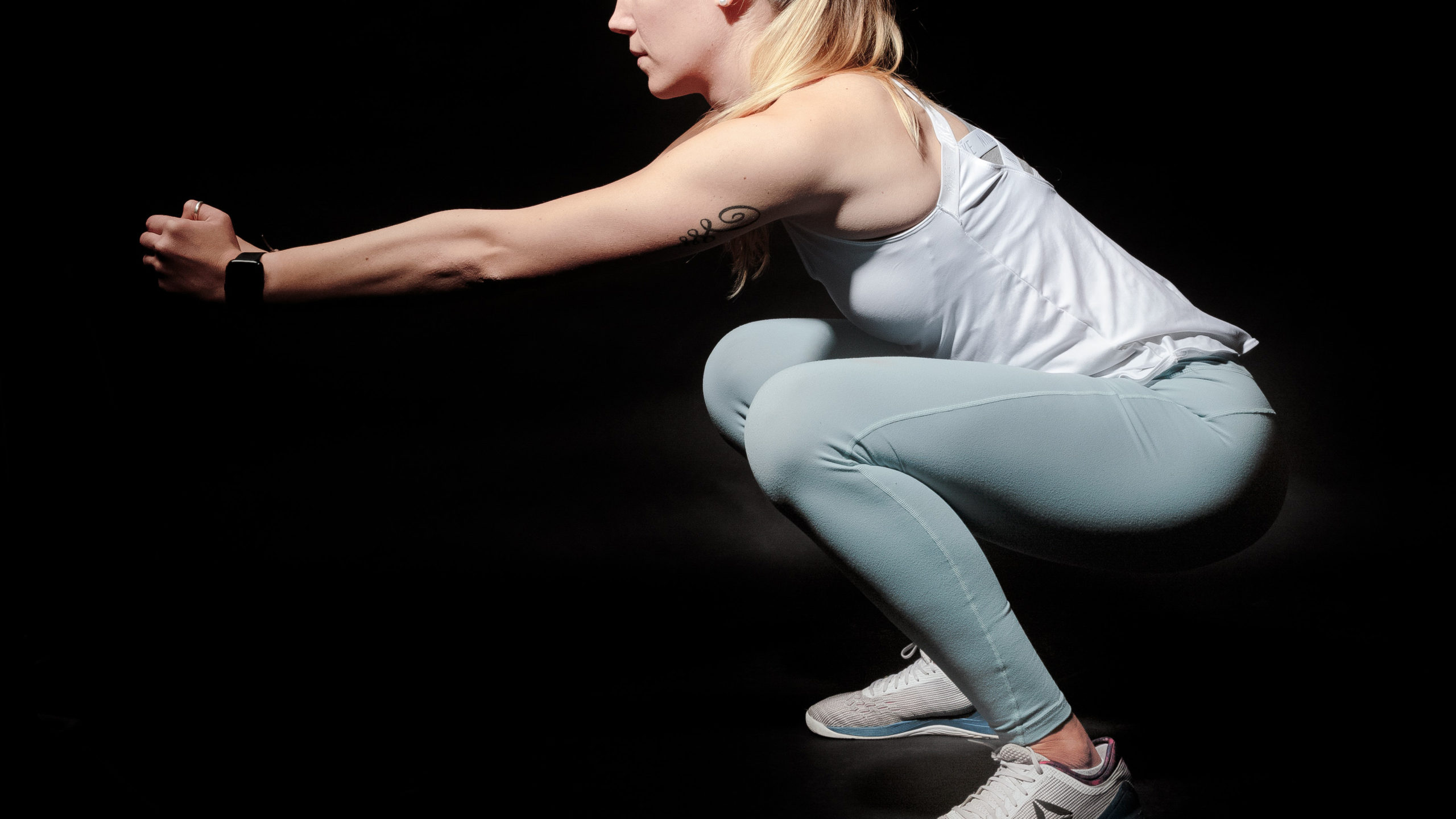 A woman doing a squat