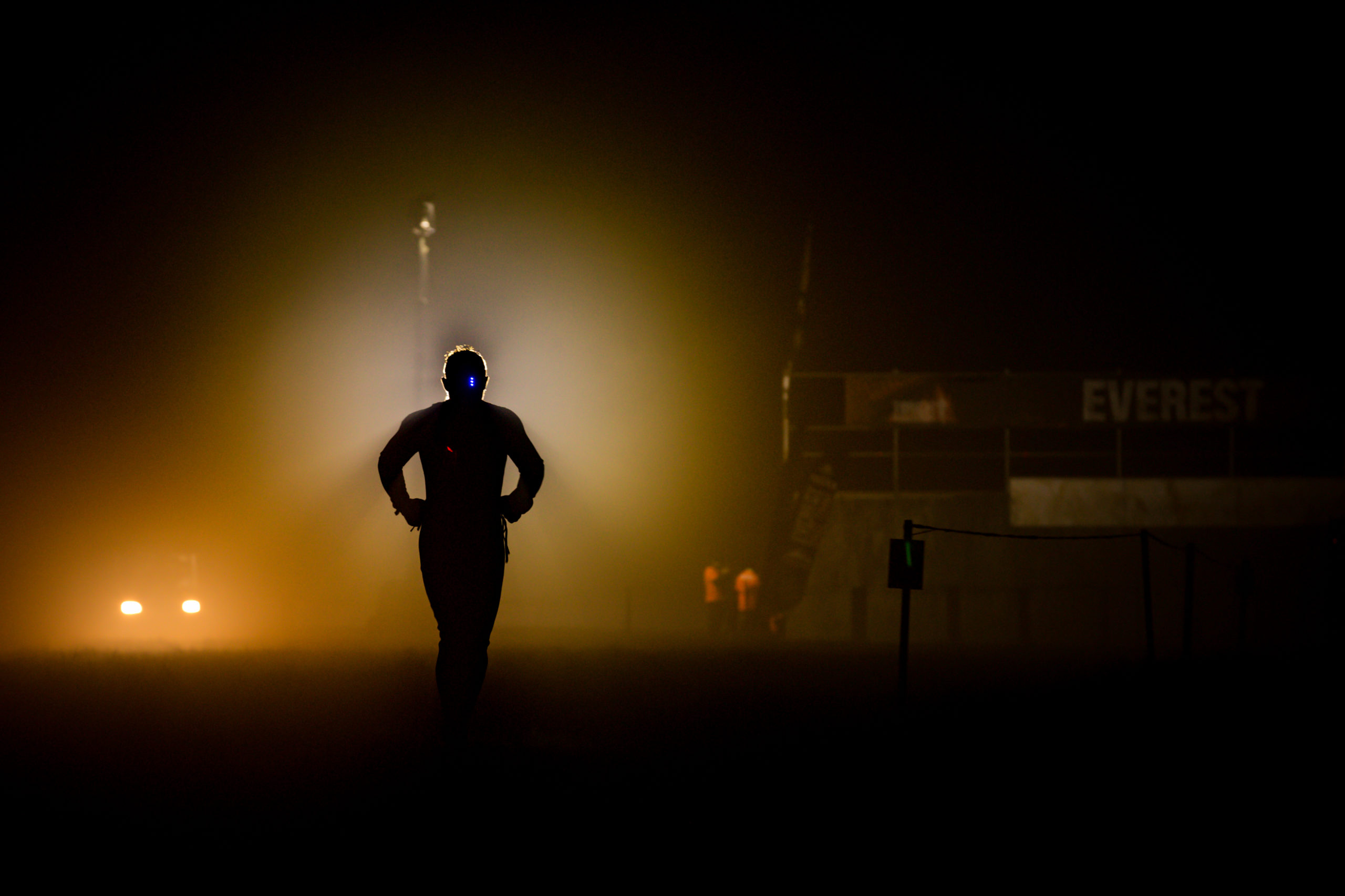 Participant running in the dark with limited lights