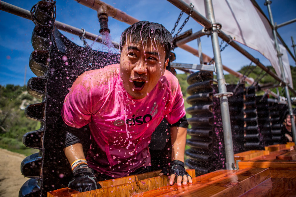 man in pink on obstacle
