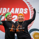 two girls in finisher shirts