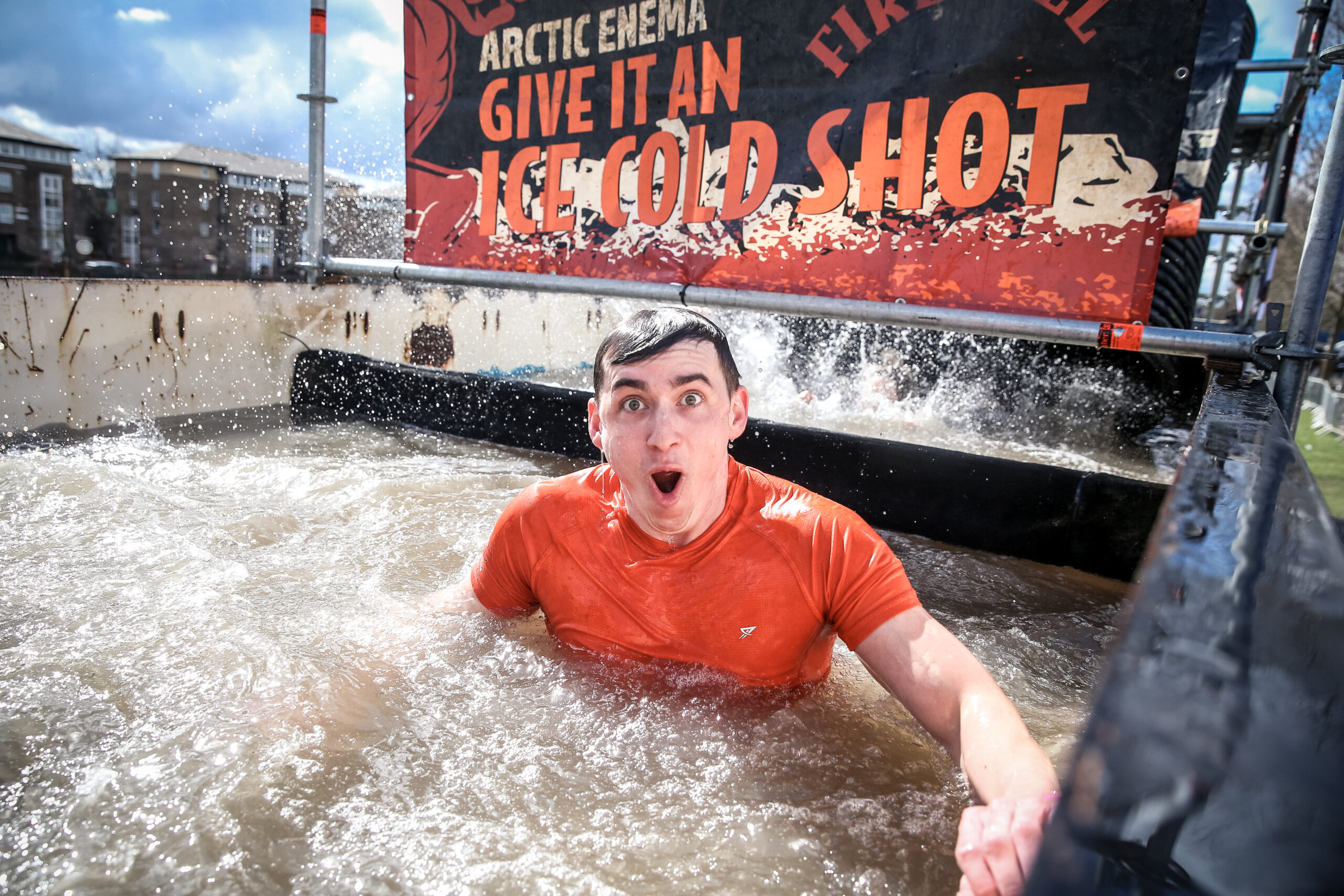 man in ice bath at Tough Mudder summer